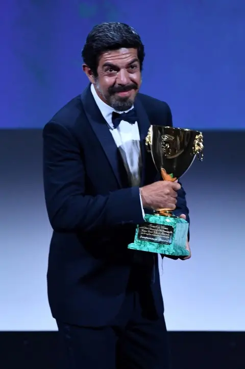 Italian actor Fierfrancesco Favino holds the Volpi Cup (Coppa Volpi) award for Best Actor for his performance in the movie 'Padrenostro' during the awarding ceremony of the 77th annual Venice International Film Festival, in Venice, Italy, 12 September 2020. The festival runs from 02 to 12 September. ANSA/ETTORE FERRARI