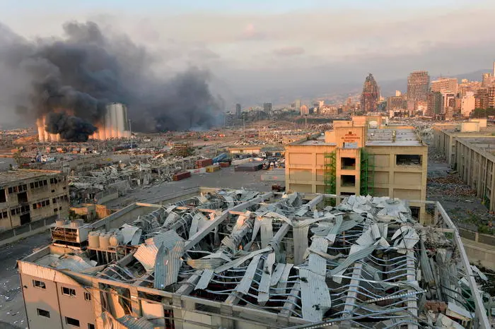 epa08583869 A general view of the harbor area with smoke billowing from an area after a large explosion rocked the harbor area of Beirut, Lebanon, 04 August 2020. According to reports, several people have been injured and large area badly damaged while the cause of the explosion is not yet known. EPA/WAEL HAMZEH