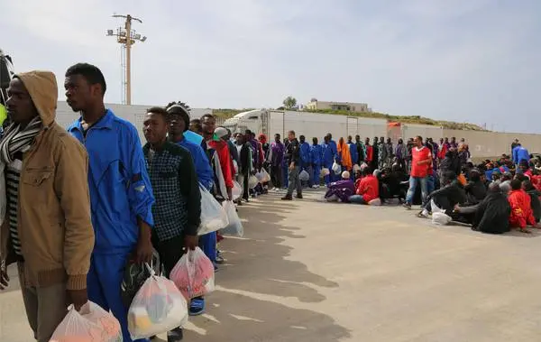 Migrants board on a cruise ship as they leave the Island of Lampedusa, Southern Italy, to be transferred in Porto Empedocle, Sicily, Friday, April 17, 2015. An unprecedented wave of migrants has headed for the European Union's promised shores over the past week, with 10,000 people making the trip. Hundreds nobody knows how many have disappeared into the warming waters of the Mediterranean, including 41 migrants reported dead Thursday after a shipwreck. (ANSA/AP Photo/Francesco Malavolta)