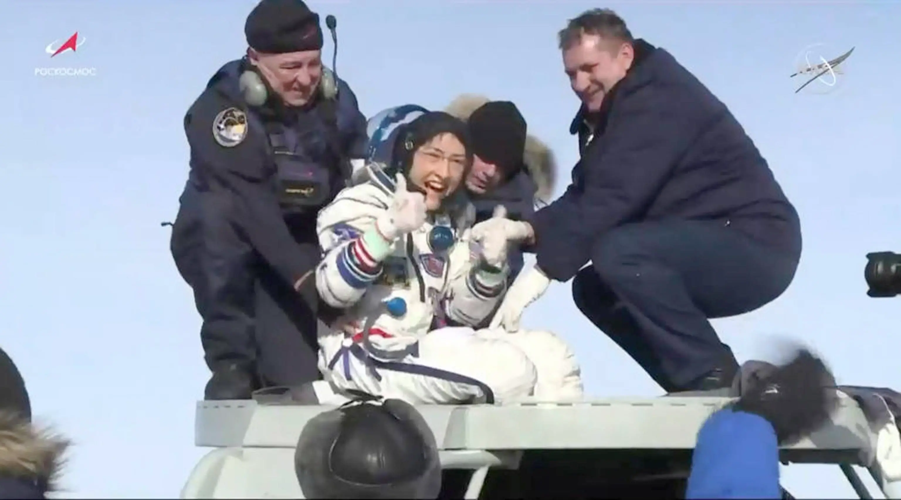 epa08197128 A handout photo made available by NASA shows NASA astronaut Christina Koch (C) giving a thumbs-up as she emerges from the Soyuz spacecraft that carried her home from a record-setting 328-day mission aboard the International Space Station (ISS), neaer Dzhezkazgan, Kazakhstan, 06 February 2020. She and her Expedition 61 crewmates, Soyuz Commander Alexander Skvortsov of Roscosmos and Luca Parmitano of ESA (European Space Agency), landed at 4:12 a.m. EST in Kazakhstan, southeast of the remote town of Dzhezkazgan. EPA/NASA TELEVISION HANDOUT -- BEST QUALITY AVAILABLE -- HANDOUT EDITORIAL USE ONLY/NO SALES