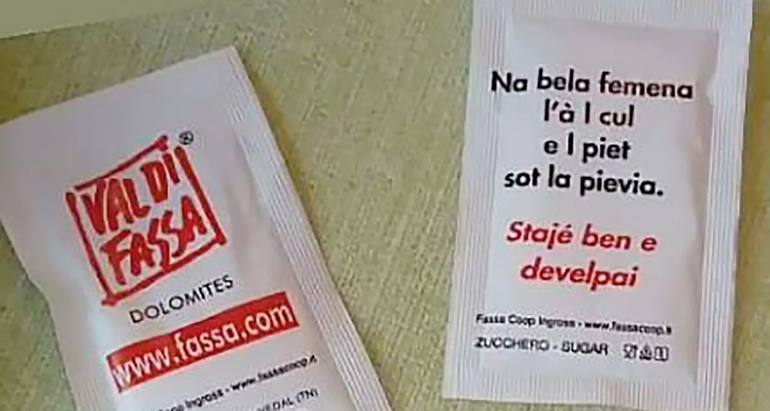 Polemica sul proverbio ladino sulle donne belle se formose stampato sulle bustine di zucchero