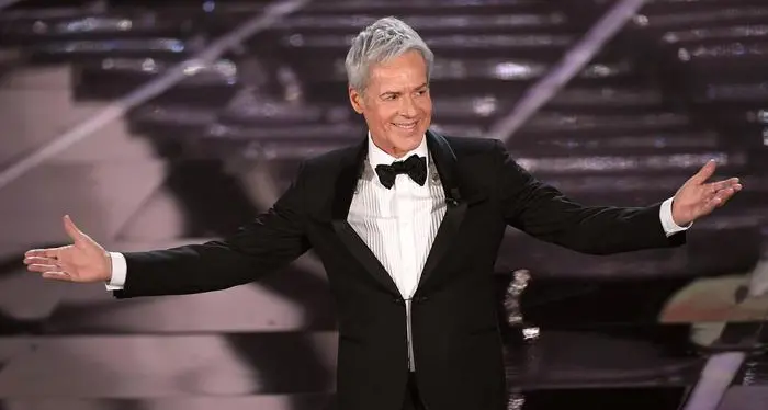 Sanremo, Baglioni e i migranti: la polemica infuria