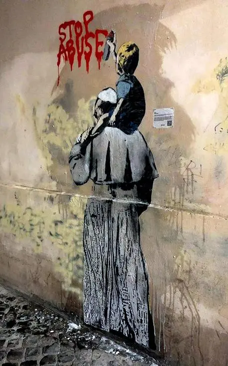 Un bambino a cavalcioni sulle spalle del papa che scrive con uno spray rosso \\\"Stop abuse\\\". E' il nuovo graffito, firmato da Tvboy, comparso oggi in vicolo degli Osti, nel centro di Roma. \\\"L'opera - scrive il collettivo artistico su Facebook - vuole essere un augurio alla risoluzione di una questione delicata e dolorosa, come quella degli abusi sessuali sui minori da parte di uomini della Chiesa, che per troppo tempo è stato un tabù e che Papa Francesco ha iniziato ad affrontare apertamente all'interno e all'esterno del Vaticano\\\". FACEBOOK TVBOY +++ATTENZIONE LA FOTO NON PUO' ESSERE PUBBLICATA O RIPRODOTTA SENZA L'AUTORIZZAZIONE DELLA FONTE DI ORIGINE CUI SI RINVIA+++