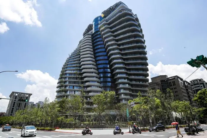 epa06934375 An exterior view of Zhu Tao Yin, nicknamed the 'twisted building' or 'forest in the air' condominium in Tapei, Taiwan, 08 August 2018. The Zhu Tao Yin, a 21-story luxury apartment building twists to allow all apartments get sunshine on every level and will be home to more than 25,000 plants. Construction on the building began in September 2013 and is scheduled to be completed in late 2018. There are two apartments on every floor, each selling for approximately one billion Taiwan dollar (30 million US dollar), making it one of the most expensive apartments people can purchase in the Asia-Pacific. EPA/RITCHIE B. TONGO