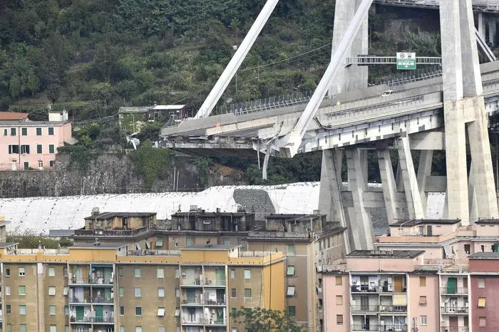 A large section of the Morandi viaduct upon which the A10 motorway runs collapsed in Genoa, Italy, 14 August 2018. Both sides of the highway fell. Around 10 vehicles are involved in the collapse, rescue sources said Tuesday. The viaduct gave way amid torrential rain. The viaduct runs over shopping centres, factories, some homes, the Genoa-Milan railway line and the Polcevera river. ANSA/FLAVIO LO SCALZO