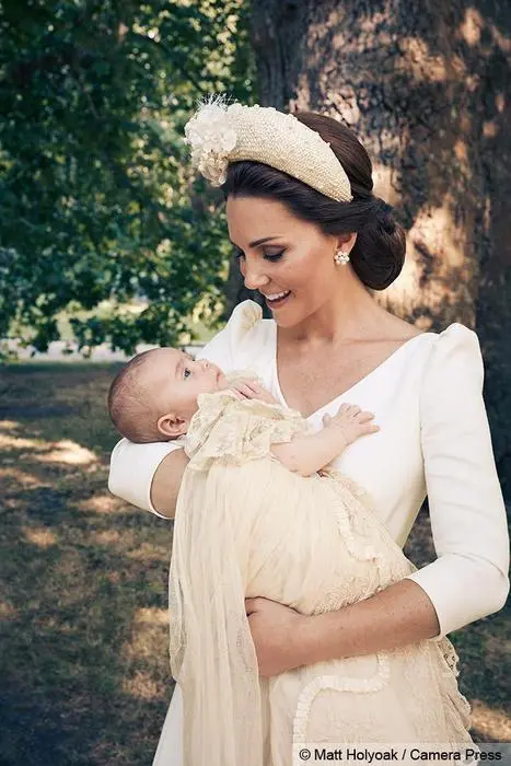 epa06892656 A handout photo made available by the Duke and Duchess of Cambridge on 16 July 2018 shows an official photograph to mark the christening of Britain's Prince Louis at Clarence House in London, Britain, 09 July 2018. The picture shows Catherine, the Duchess of Cambridge with her newly christened son Prince Louis in the grounds of Clarence House. Prince Louis, born on 23 April 2018, is the Duke and Duchess of Cambridge's third child and fifth in line to the British throne. EPA/MATT HOLYOAK / CAMERA PRESS / HANDOUT ATTENTION EDITORS: MANDATORY CREDIT: MATT HOLYOAK/CAMERA PRESS / EDITORIAL USE ONLY / NO COMMERCIAL USAGE / NO SALES / NO ARCHIVE / NEWS USAGE ONLY IN CONNECTION WITH PRINCE LOUIS' CHRISTENING / IMAGE MUST BE USED IN IT'S ENTIRETY - NO CROPPING PERMITTED HANDOUT EDITORIAL USE ONLY/NO SALES/NO ARCHIVES *** Local Caption *** BSMID7259315