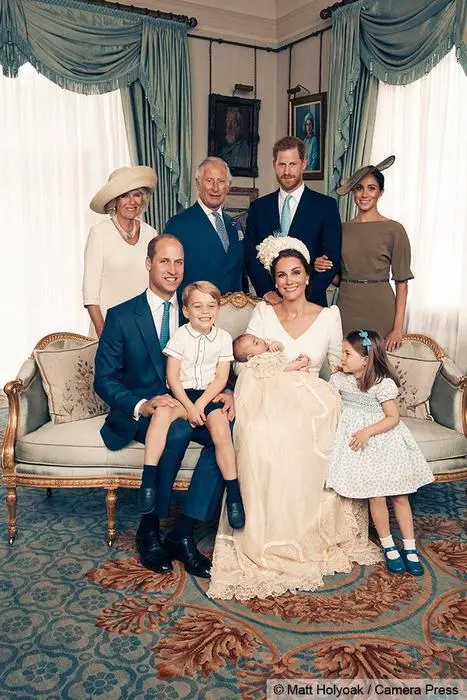 epa06892654 A handout photo made available by the Duke and Duchess of Cambridge on 16 July 2018 shows an official photograph to mark the christening of Britain's Prince Louis at Clarence House in London, Britain, 09 July 2018. The picture shows (Seated, L-R) Prince William, the Duke of Cambridge, Prince George, Catherine, the Duchess of Cambridge with the newly christened Prince Louis and Princess Charlotte and (Standing, L-R) Camilla, the Duchess of Cornwall, Charles, the Prince of Wales, Prince Harry, the Duke of Sussex and Meghan, the Duchess of Sussex in the Morning Room at Clarence House, following the christening of Prince Louis at St James's Chapel. EPA/MATT HOLYOAK / CAMERA PRESS / HANDOUT ATTENTION EDITORS: MANDATORY CREDIT: MATT HOLYOAK/CAMERA PRESS / EDITORIAL USE ONLY / NO COMMERCIAL USAGE / NO SALES / NO ARCHIVE / NEWS USAGE ONLY IN CONNECTION WITH PRINCE LOUIS' CHRISTENING / IMAGE MUST BE USED IN IT'S ENTIRETY - NO CROPPING PERMITTED HANDOUT EDITORIAL USE ONLY/NO SALES/NO ARCHIVES *** Local Caption *** BSMID7259315