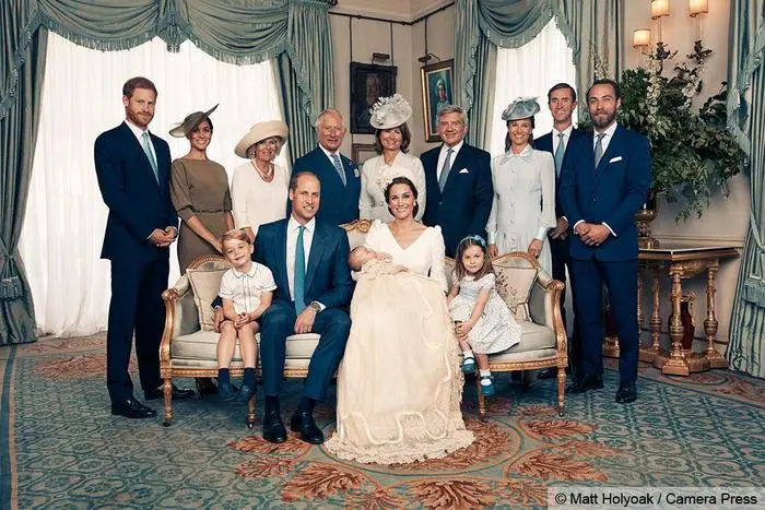 epa06892658 A handout photo made available by the Duke and Duchess of Cambridge on 16 July 2018 shows an official photograph to mark the christening of Britain's Prince Louis at Clarence House in London, Britain, 09 July 2018. The picture shows (Seated, L-R) Prince George, Prince William, the Duke of Cambridge, Catherine, the Duchess of Cambridge with the newly christened Prince Louis and Princess Charlotte and (Standing, L-R) Prince Harry, the Duke of Sussex and Meghan, the Duchess of Sussex, Camilla, the Duchess of Cornwall, Charles, the Prince of Wales, Carole Middleton, Michael Middleton, Pippa Matthews, James Matthews and James Middleton in the Morning Room at Clarence House, following the christening of Prince Louis at St James's Chapel. EPA/MATT HOLYOAK / CAMERA PRESS / HANDOUT ATTENTION EDITORS: MANDATORY CREDIT: MATT HOLYOAK/CAMERA PRESS / EDITORIAL USE ONLY / NO COMMERCIAL USAGE / NO SALES / NO ARCHIVE / NEWS USAGE ONLY IN CONNECTION WITH PRINCE LOUIS' CHRISTENING / IMAGE MUST BE USED IN IT'S ENTIRETY - NO CROPPING PERMITTED HANDOUT EDITORIAL USE ONLY/NO SALES/NO ARCHIVES *** Local Caption *** BSMID7259315