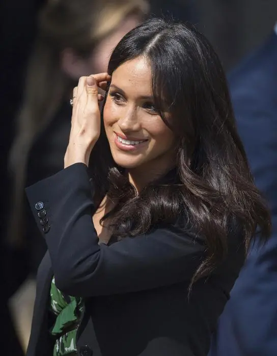Meghan Markle leaves the Australian High Commission in London with Britain's Prince Harry after attending a reception celebrating the forthcoming Invictus Games Sydney 2018, Saturday April 21, 2018. (Dominic Lipinski/PA via AP)