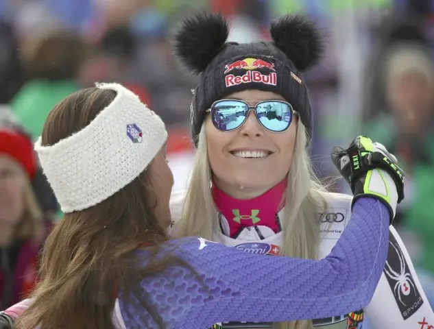 United States' Lindsey Vonn, right is congratulated by Italy's Sofia Goggia after winning a women's downhill, at the alpine ski World Cup finals in Are, Sweden, Wednesday, March 14, 2018. (ANSA/AP Photo/Marco Trovati) [CopyrightNotice: Copyright 2018 The Associated Press. All rights reserved.]