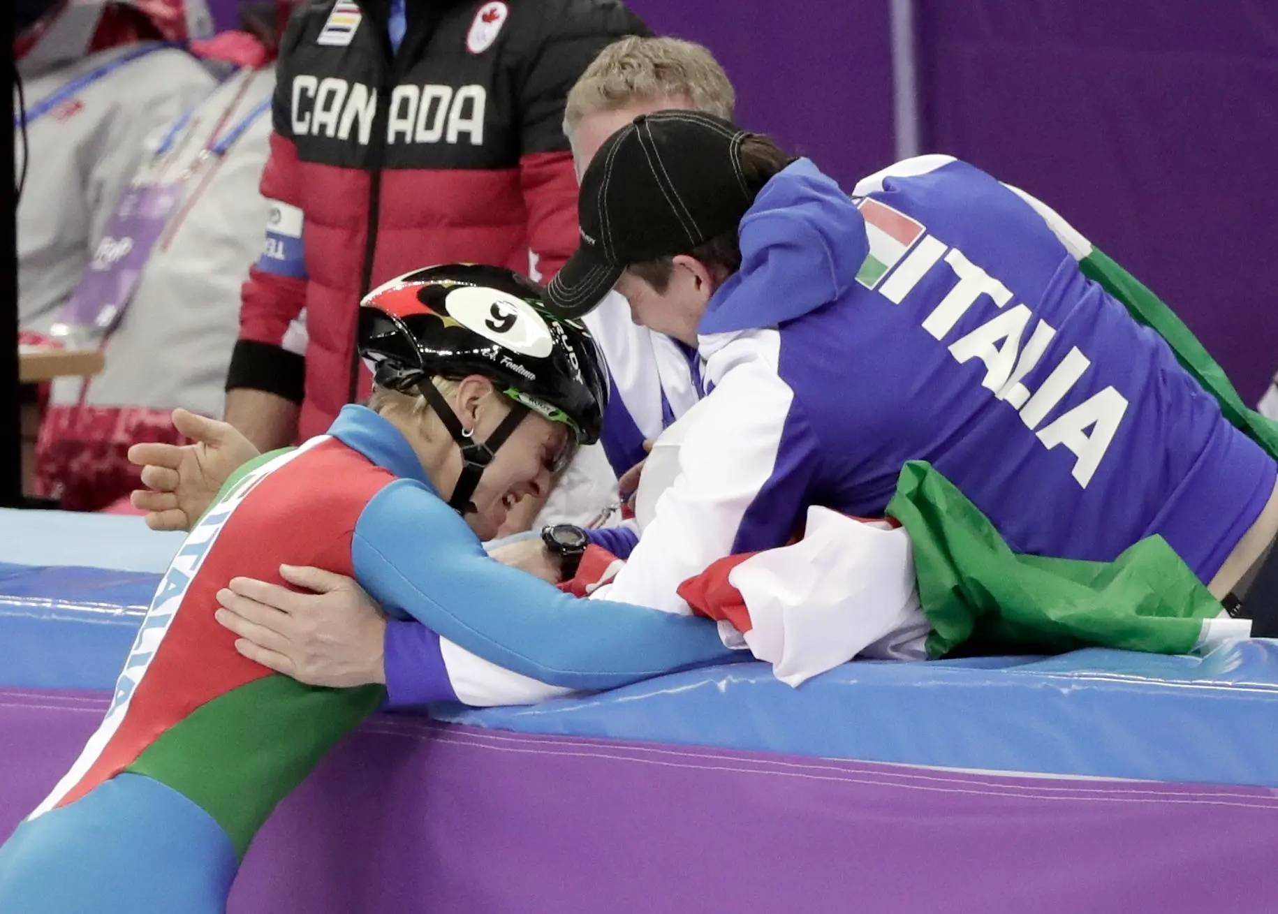 Arianna Fontana of Italy celebrates with her teammates after winning the ladies' 500 meters short track speedskating final in the Gangneung Ice Arena at the 2018 Winter Olympics in Gangneung, South Korea, Tuesday, Feb. 13, 2018. (ANSA/AP Photo/Julie Jacobson) [CopyrightNotice: Copyright 2018 The Associated Press. All rights reserved]