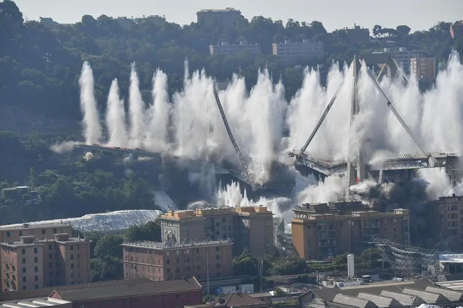 A general view of the demolition \\\"pile\\\" 10 and 11 Morandi bridge with micro-explosive charges, in Genoa, Italy, 28 june 2019. The new viaduct replacing the Morandi bridge is expected to be completed by 2020. The Morandi bridge partially collapsed on 14 august 2018 killing 43 people. ANSA/LUCA ZENNARO