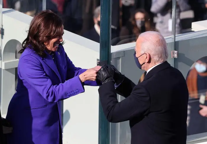 epa08952866 Vice President Kamala Harris celebrates with President-elect Joe Biden after being sworn in during the inauguration of Joe Biden as US President in Washington, DC, USA, 20 January 2021. Biden won the 03 November 2020 election to become the 46th President of the United States of America. EPA/TASOS KATOPODIS / POOL