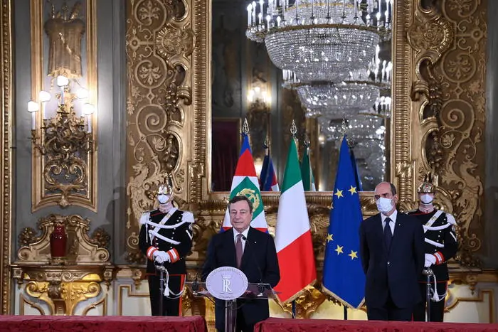 epa09007573 Italian Prime Minister-designate Mario Draghi addresses the media to announce his list of Ministers after a meeting with Italian President Mattarella, in Rome, Italy, 12 February 2021. Premier-designate Draghi has formally accepted to lead a government after meeting with President Mattarella. Mattarella gave Draghi a mandate to form a government after outgoing Premier Conte's collapsed. EPA/Alessandro Di Meo / POOL