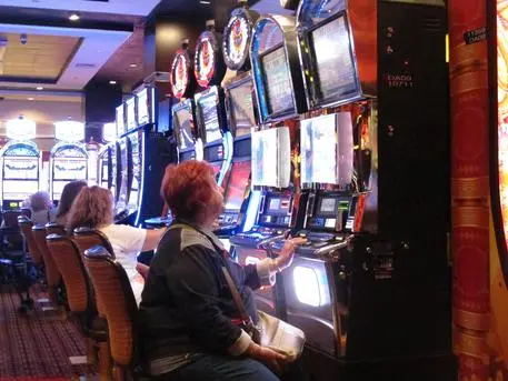 In this June 24, 2016, photo, a gambler plays a slot machine at the Golden Nugget casino in Atlantic City, N.J. On Thursday, Sept. 22, 2016, the men who are proposing to build two new casinos in northern New Jersey near New York City, concluded the statewide ballot question that would authorize the projects will not pass, and ended their financial support for a campaign in its favor. (ANSA/AP Photo/Wayne Parry) [CopyrightNotice: Copyright 2016 The Associated Press. All rights reserved.]