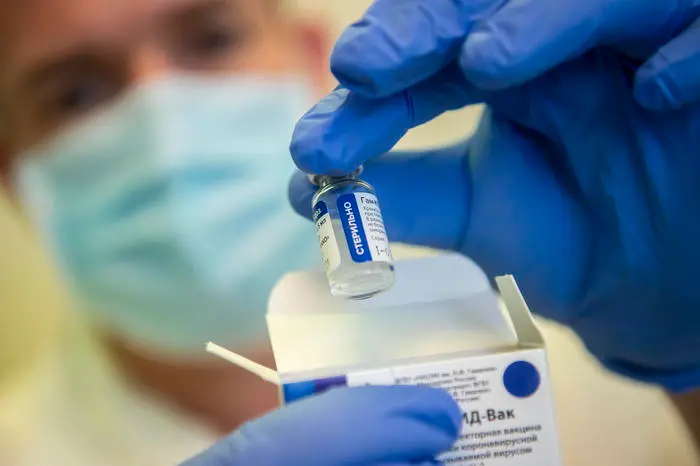 epa09024029 A health worker holds a vial of the Russian vaccine Sputnik V at the Bacs-Kiskun County Training Hospital in Kecskemet, Hungary, 19 February 2021, as the vaccination with Sputnik V against the new coronavirus continues in the country. EPA/SANDOR UJVARI HUNGARY OUT