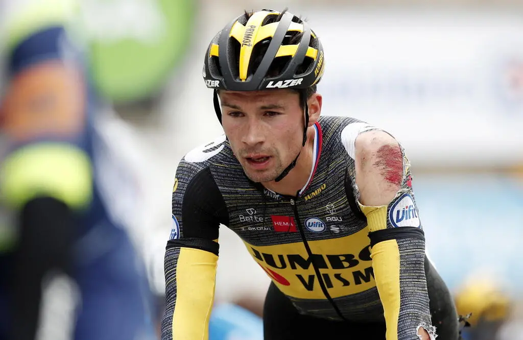 epa09308330 Slovenian rider Primoz Roglic of the Jumbo Visma team rolls across the finish line of the 3rd stage of the Tour de France 2021 over 182.9 km from Lorient to Pontivy, France, 28 June 2021. Roglic was involved in a crash some 10km before the finish. EPA/Benoit Tessier / POOL