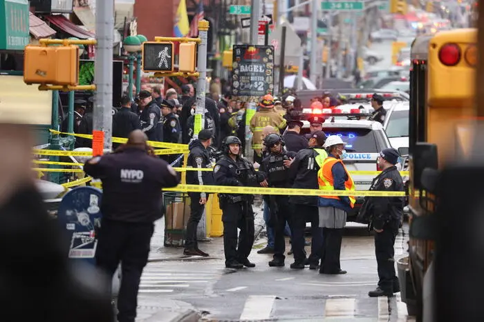 epa09885956 New York City Police and Fire Department officials on the scene of a reported multiple shooting at a New York City Subway station in the Brooklyn borough of New York, New York, USA, 12 April 2022. EPA/JUSTIN LANE