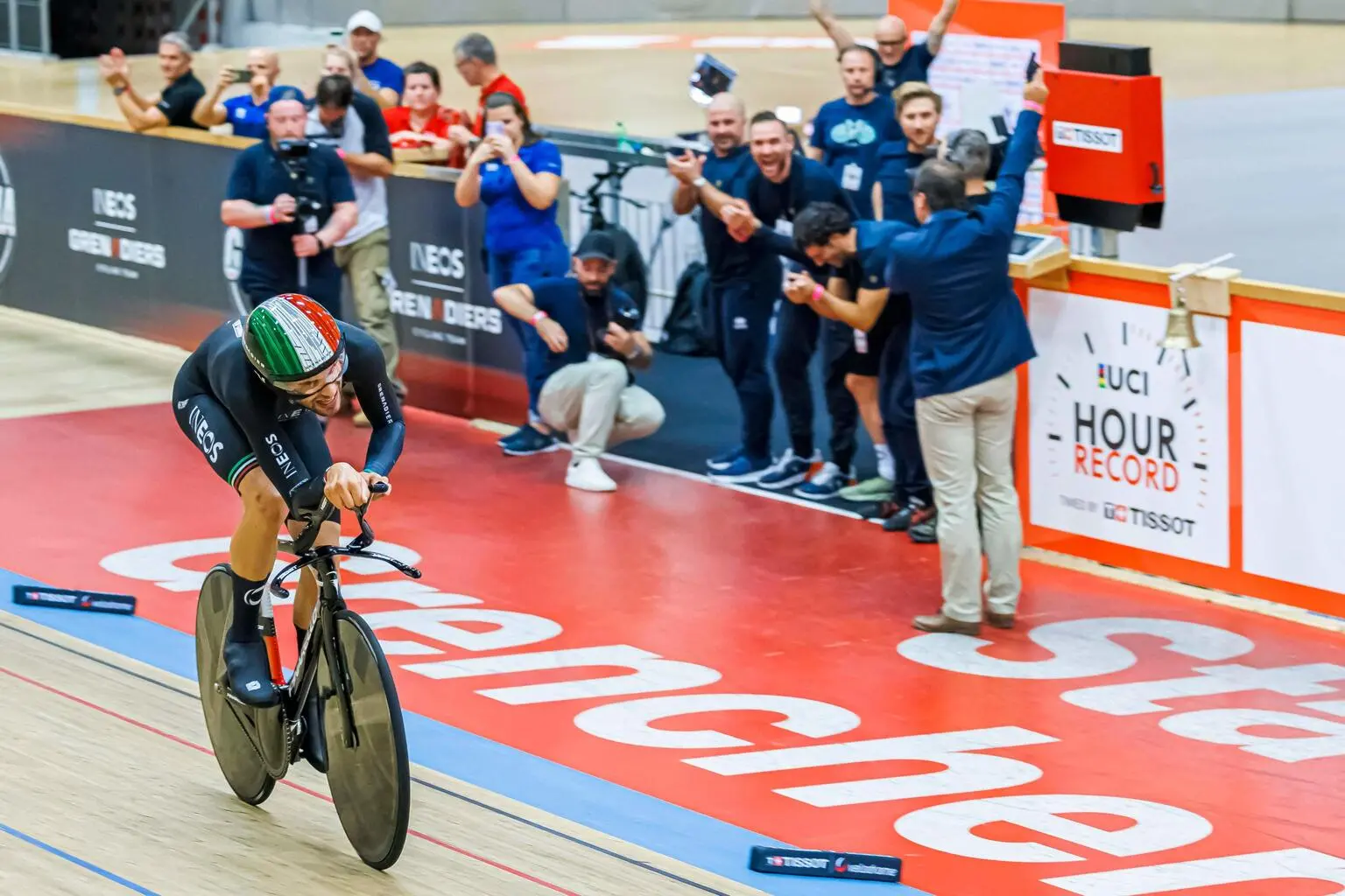 Ineos Grenadiers' Italian rider Filippo Ganna reacts after breaking the hour record with a distance of 56.792km in the Velodrome Suisse, an indoor velodrome in Grenchen, northern Switzerland on October 8, 2022. (Photo by Valentin FLAURAUD / AFP)