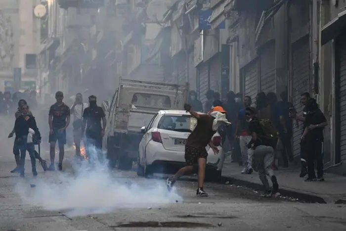Protesters clash with CRS riot police at the Porte d'Aix in Marseille, southern France on June 30, 2023, over the shooting of a teenage driver by French police in a Paris suburb on June 27. The unrest has come in response to the killing of 17-year-old Nahel, whose death has revived longstanding grievances about policing and racial profiling in France's low-income and multi-ethnic suburbs. (Photo by CHRISTOPHE SIMON / AFP)
