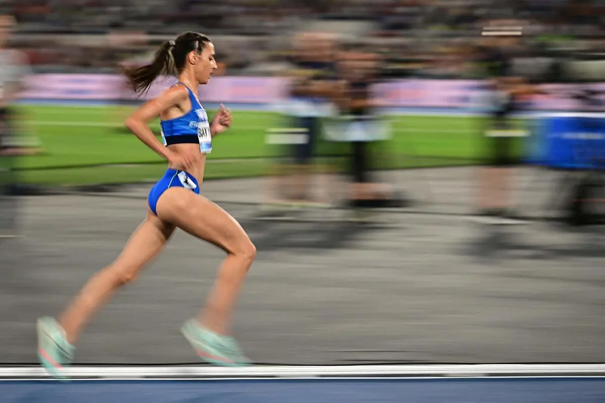 Italy's Nadia Battocletti competes in the women's 5000m event of the Diamond League athletics meeting at the Olympic stadium in Rome on June 6, 2025. (Photo by Tiziana FABI / AFP)