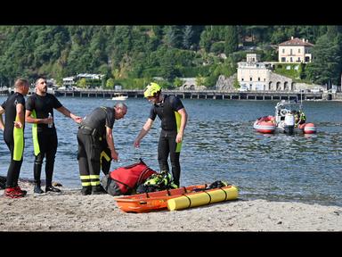 Lago artificiale con sommozzatori al lavoro durante operazioni di ricerca e recupero in un parco, immagine di approfondimento